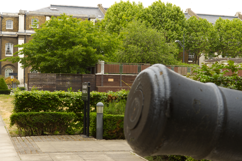 View of the park past a cannon