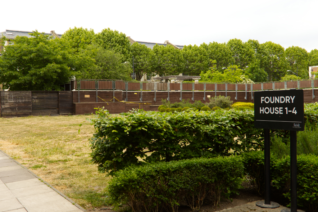 View of the foundry house sign with the park behind